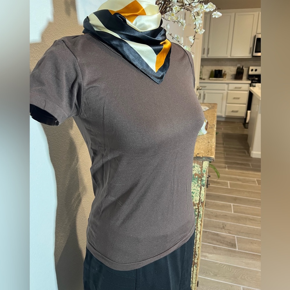 Women’s short sleeved shirt, size small/medium.